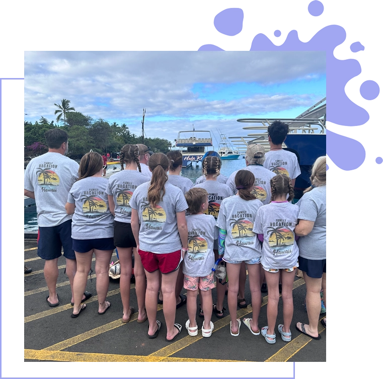 A group of people standing in front of a boat.